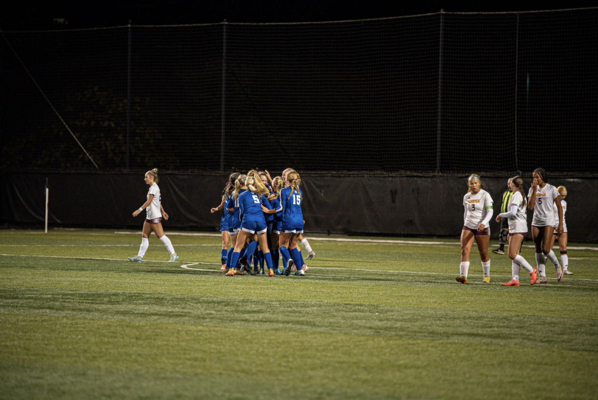 The Highlands Girls Soccer team celebrates with Kendall Graves (12) after scoring.